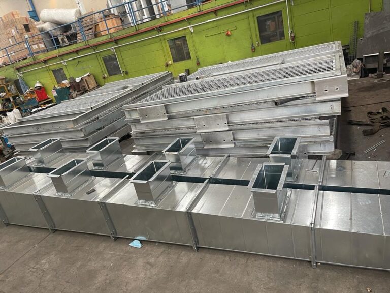 Painting booth panels during fabrication for a customer in Cikarang